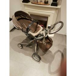 Stokke reiswieg en buggy met luiertas.