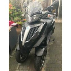 Piaggo 300cc mp3 met Akrapovic uitlaat