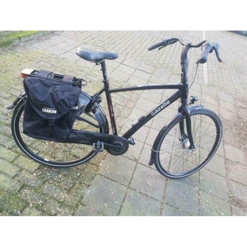 Tekoop zwarte Gezelle herenfiets. +_ 50 Kilometer op gefie