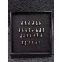 Collection of 27 Egyptian crystal poppy bead amulets