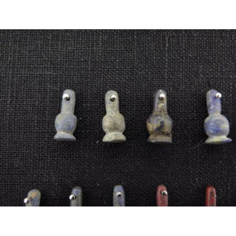 Collection of 27 Egyptian crystal poppy bead amulets